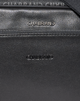 Gros plan toile enduite siglée noire - New Freedom - Chabrand